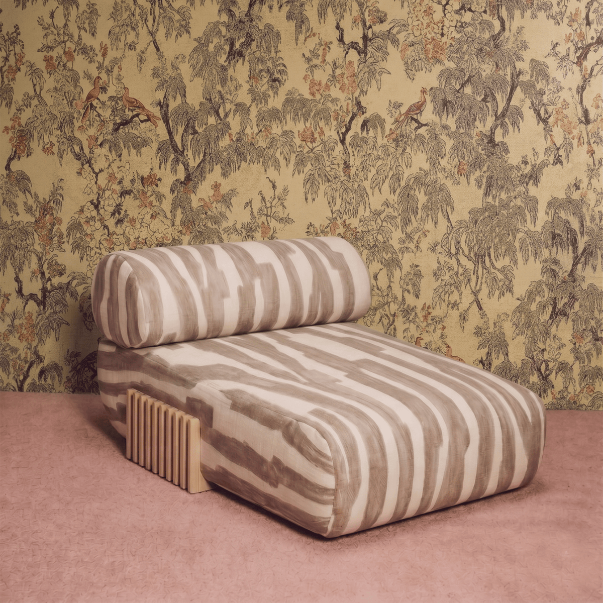 Carmel Chaise Lounge in striped fabric against botanical wallpaper on a pink floor