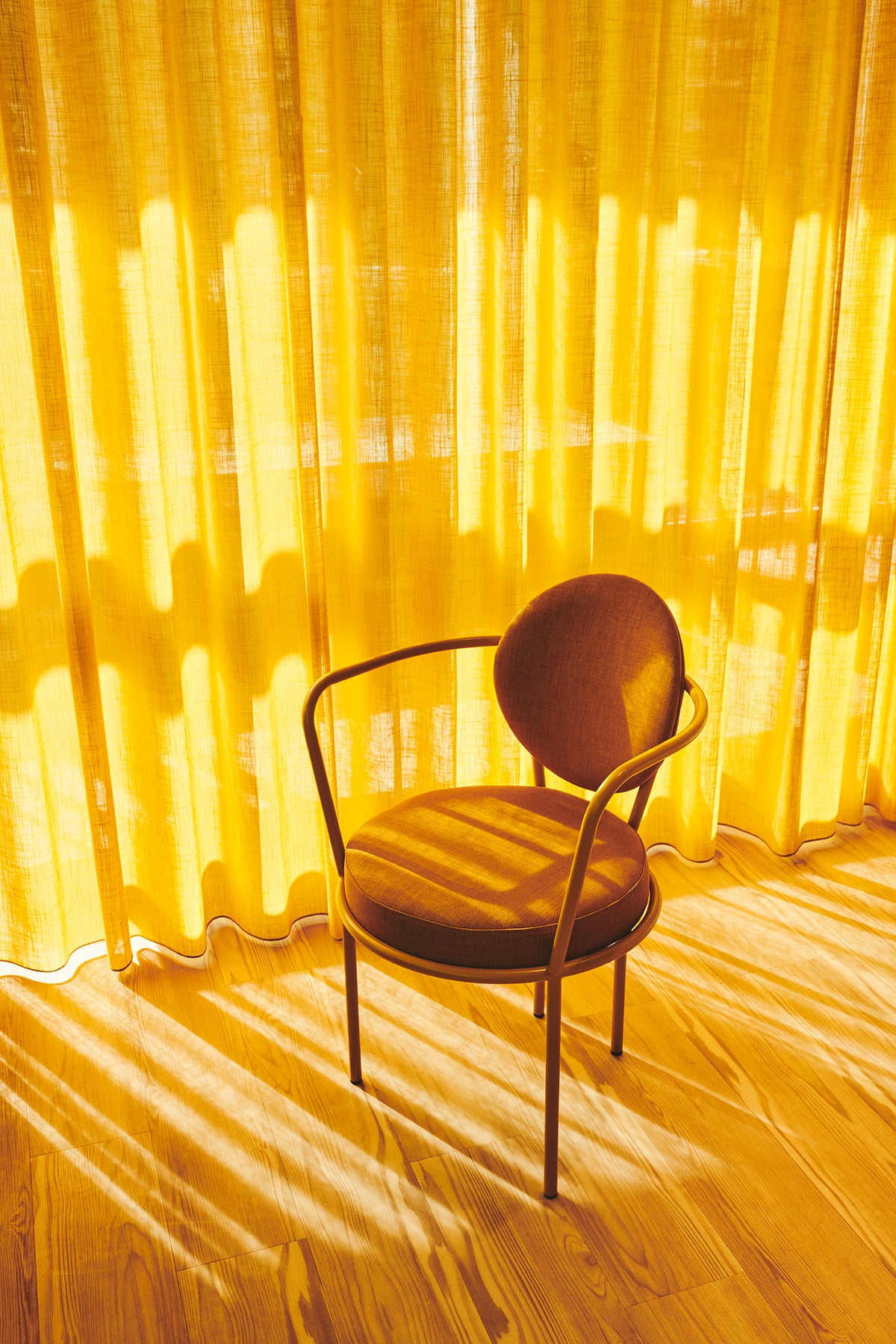 Casablanca Chair with brown frame in a yellow room by Maison Burgos
