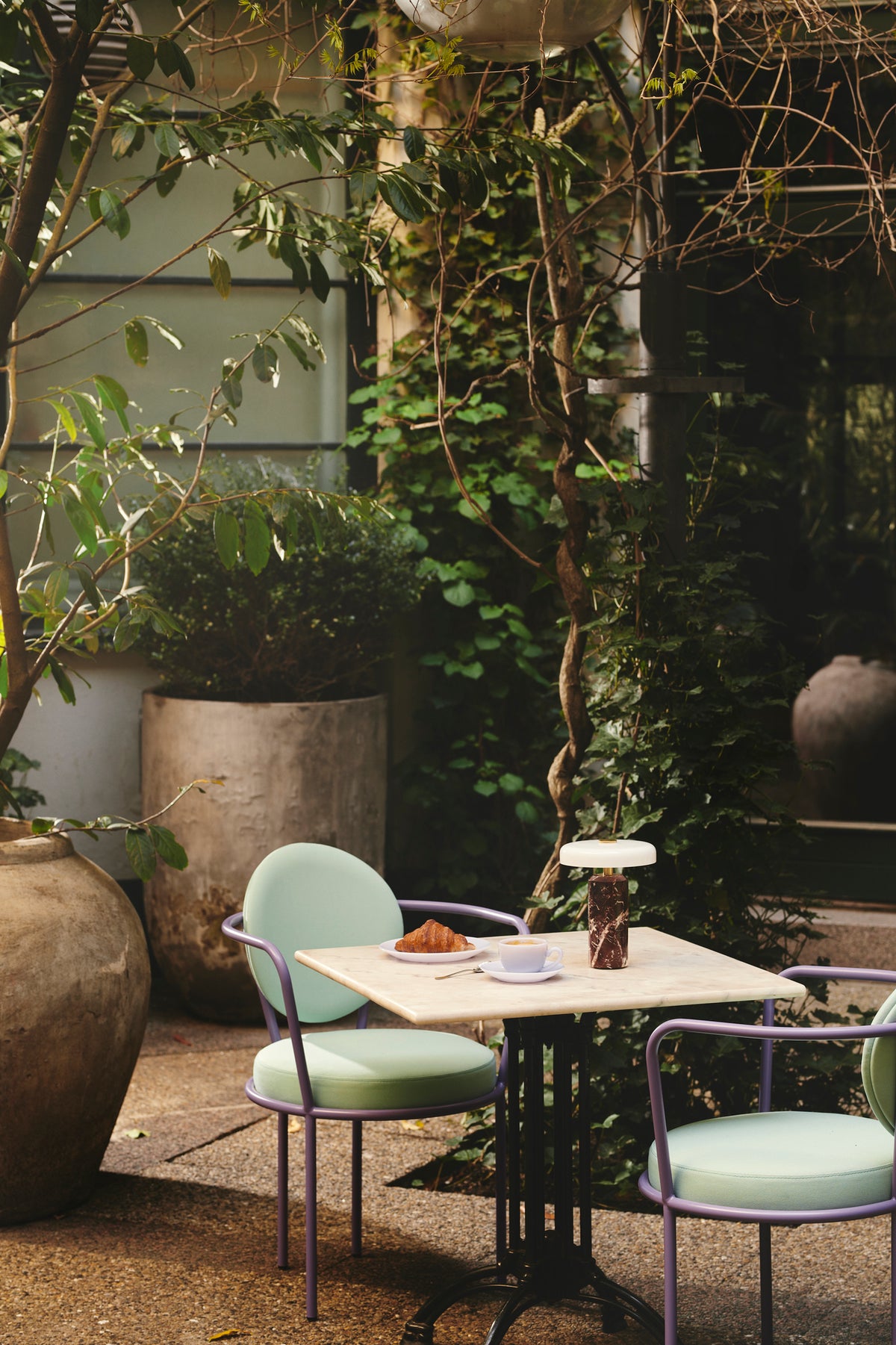 Casablanca Chairs with colored frames in a garden by Maison Burgos