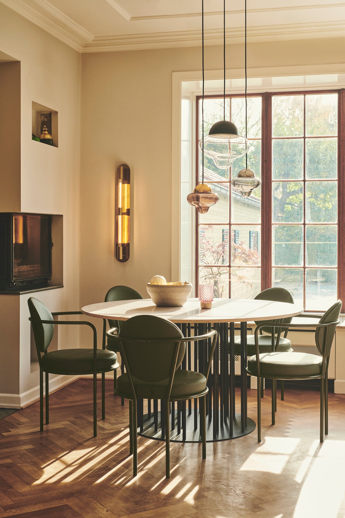 Casablanca Chairs around a dining table in a sunlit room by Maison Burgos