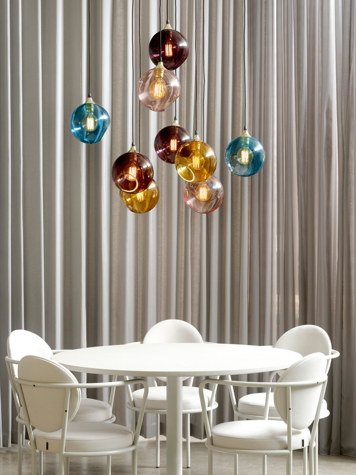 White Casablanca Chairs under Ballroom pendants by Maison Burgos