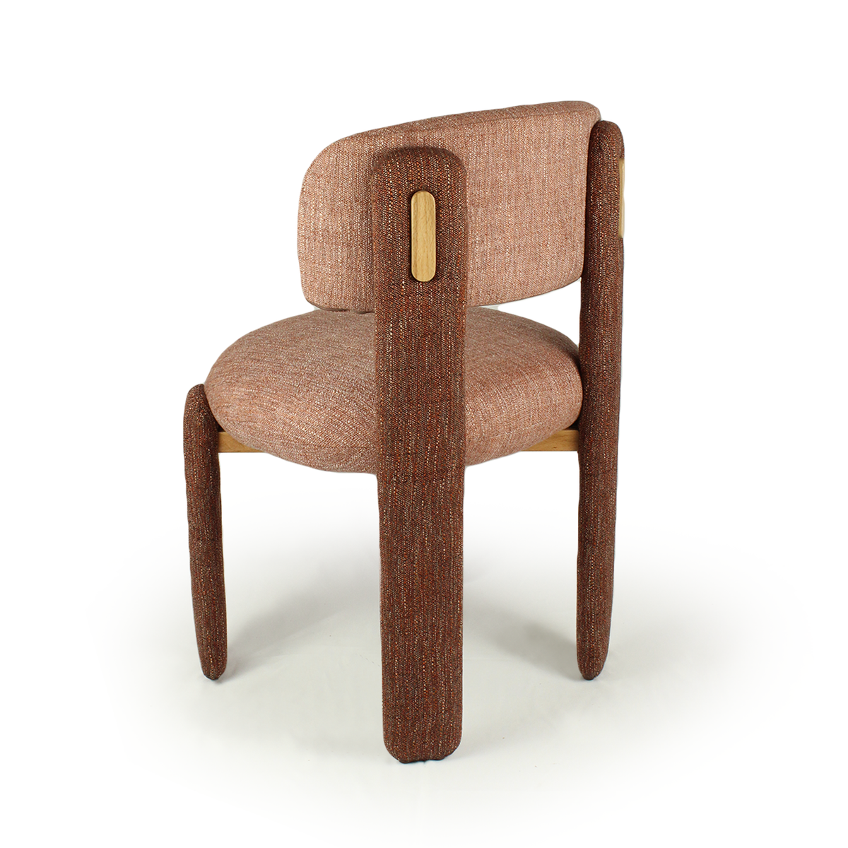 Choux Dining Chair in pink weave with brown legs, rear three-quarter view