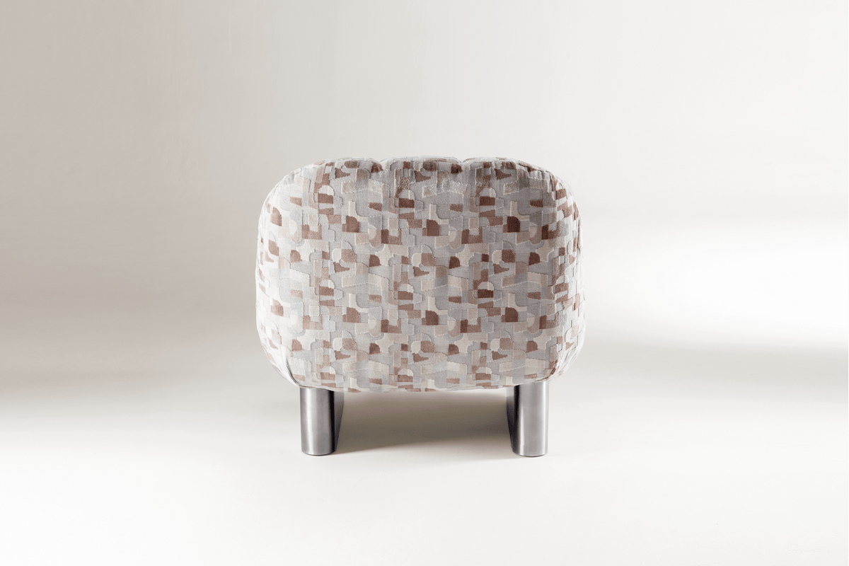 Colin Armchair in geometric patterned fabric with chrome legs, back view