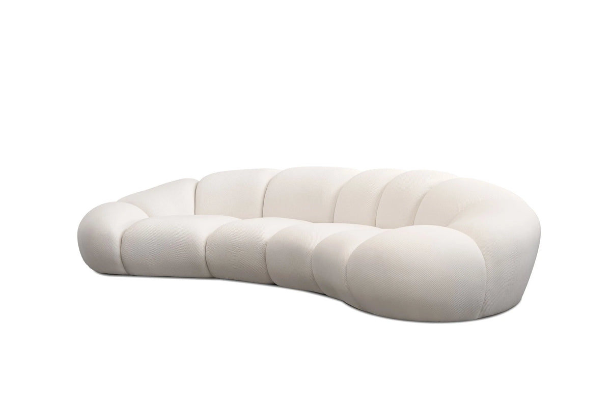 Cirro Sofa - 4-Seater in Buttermilk, three-quarter view of curved shape