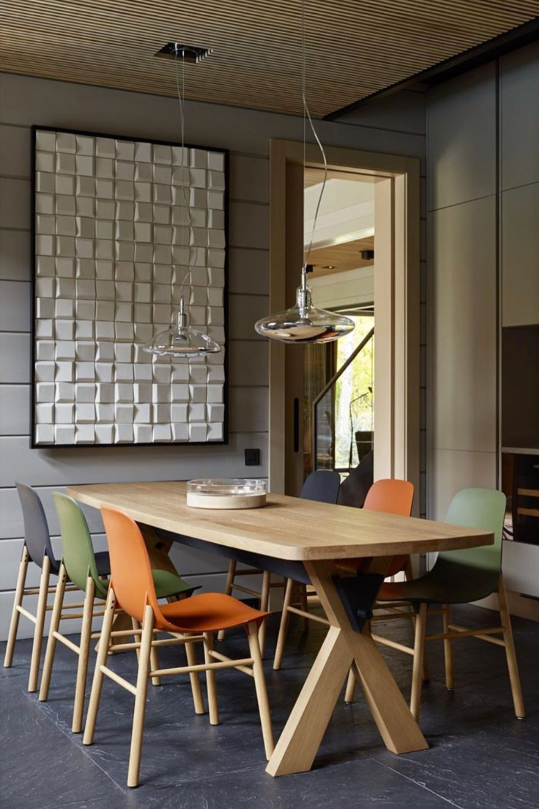 Douro Panel in pale glazed tiles above a dining table