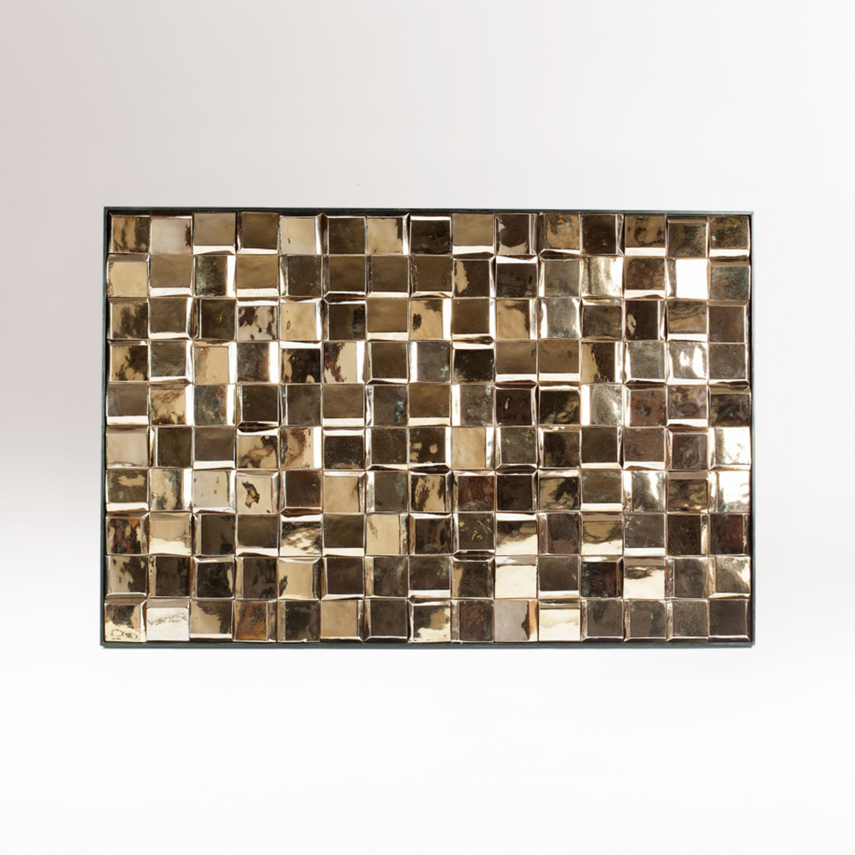 Douro Panel in Gold glazed tiles hung on a white wall