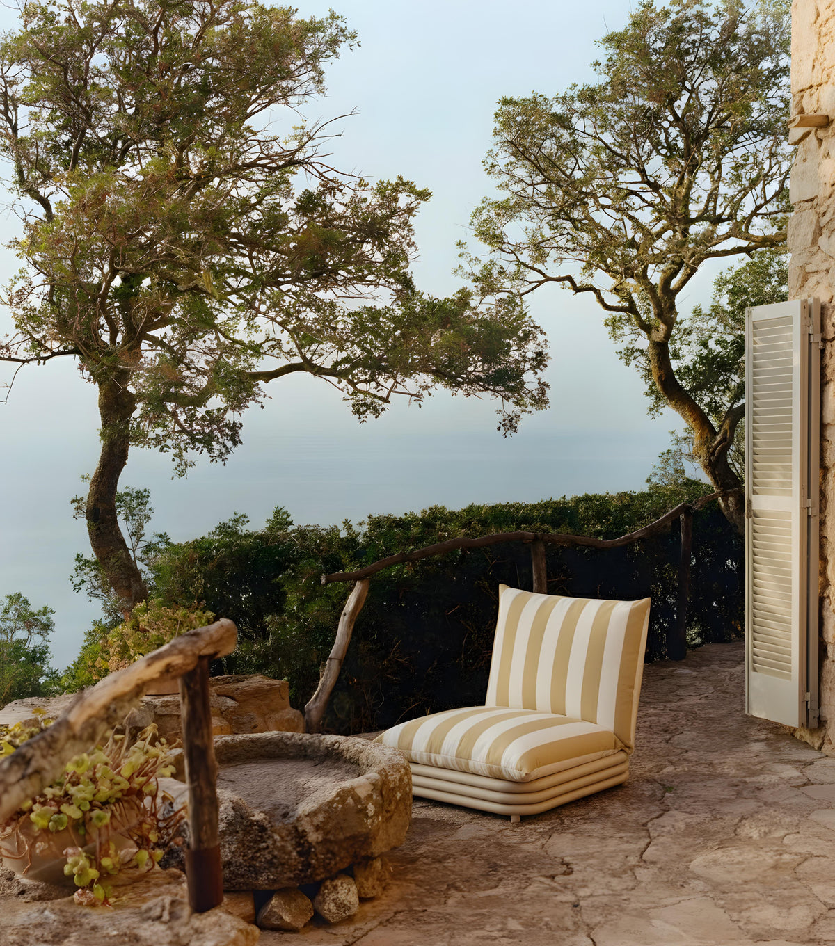 Duna Outdoor Armchair in a garden setting by Maison Burgos