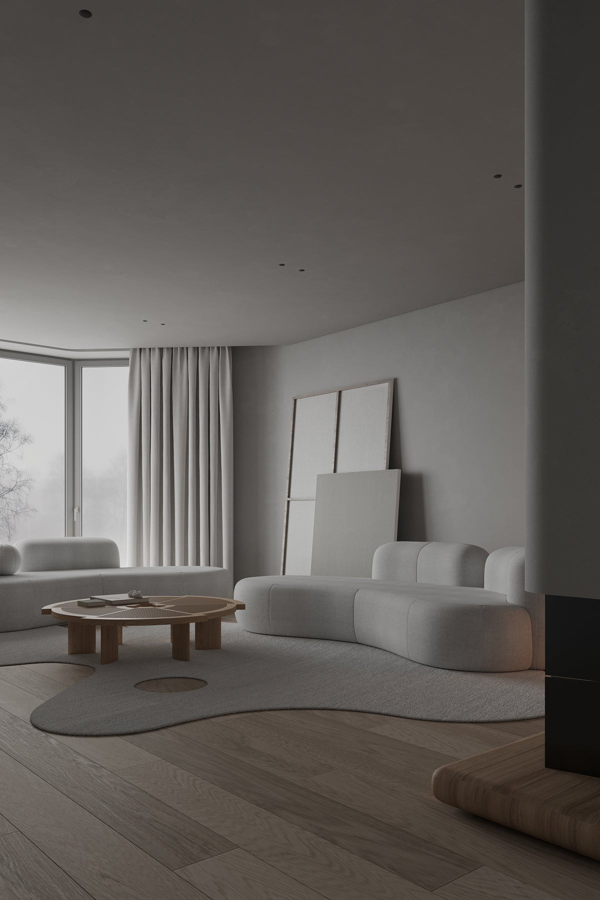 Tateyama XL Sofa in white boucle in a dim living room with a low wood table