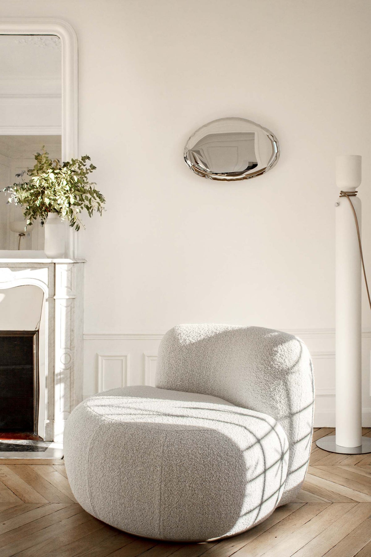 B-15 Z Lounge Chair in ivory bouclé in a Parisian room with herringbone floor and fireplace