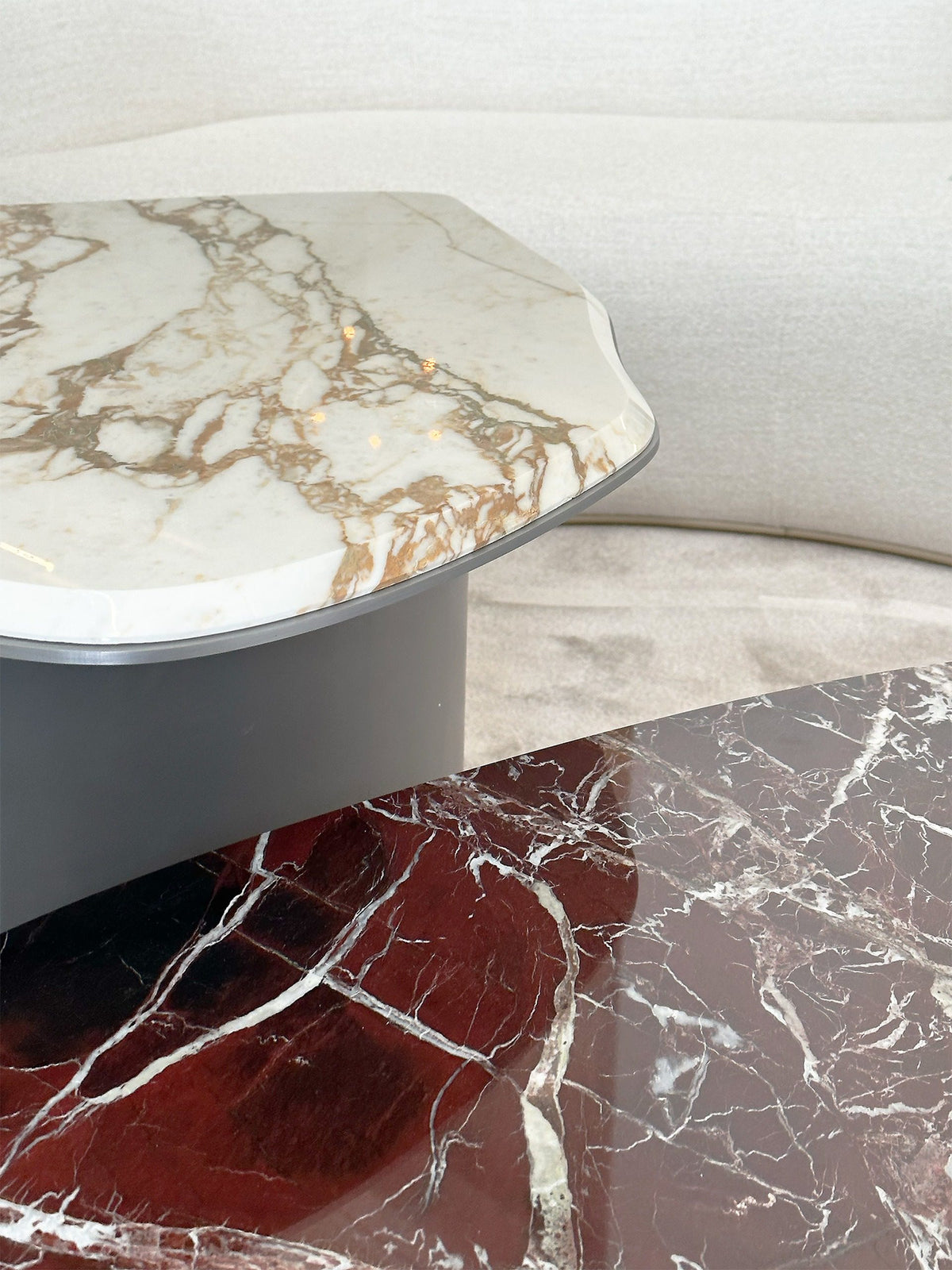 Fragment Coffee Tables close-up of gold-veined white and red marble tops