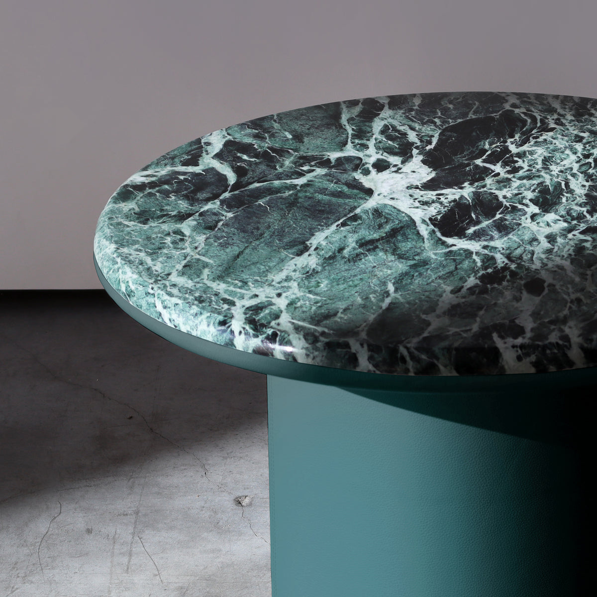 Gemini Round Side Tables close-up of the green marble top edge