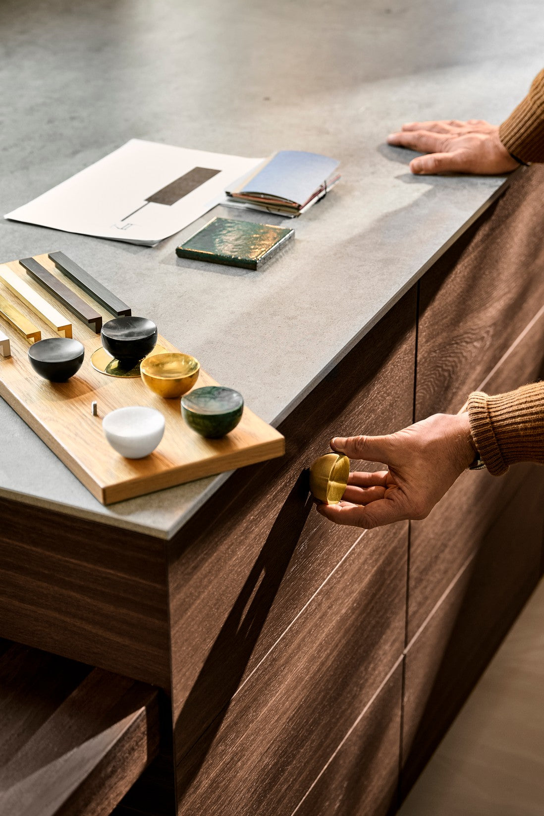 Get a Grip handle and knob finish samples on a walnut drawer unit by Maison Burgos