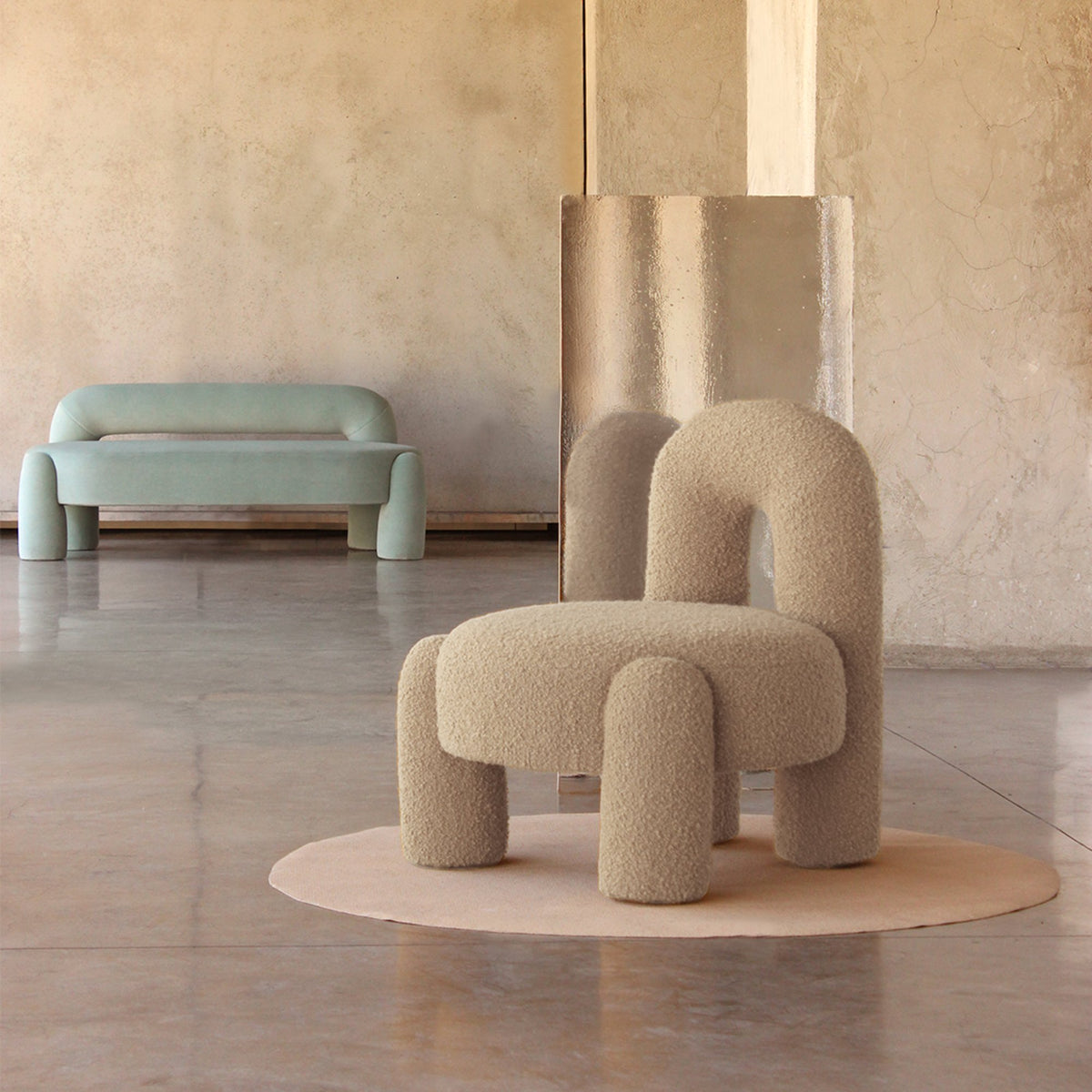 Marlon Daybed - 02 in mint with a beige bouclé armchair in a plaster room
