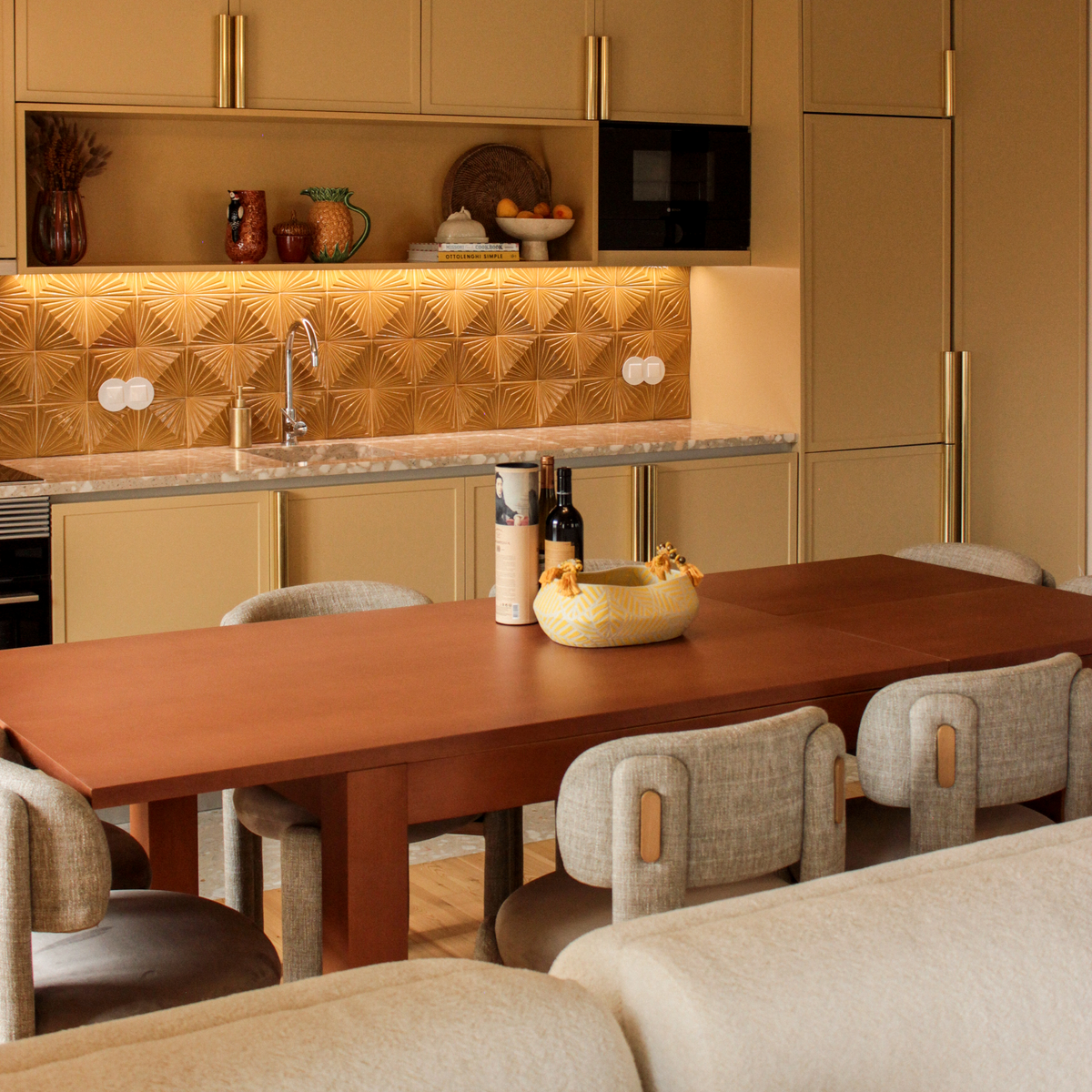 Choux Dining Chair in ivory weave at a long wood dining table in a modern kitchen