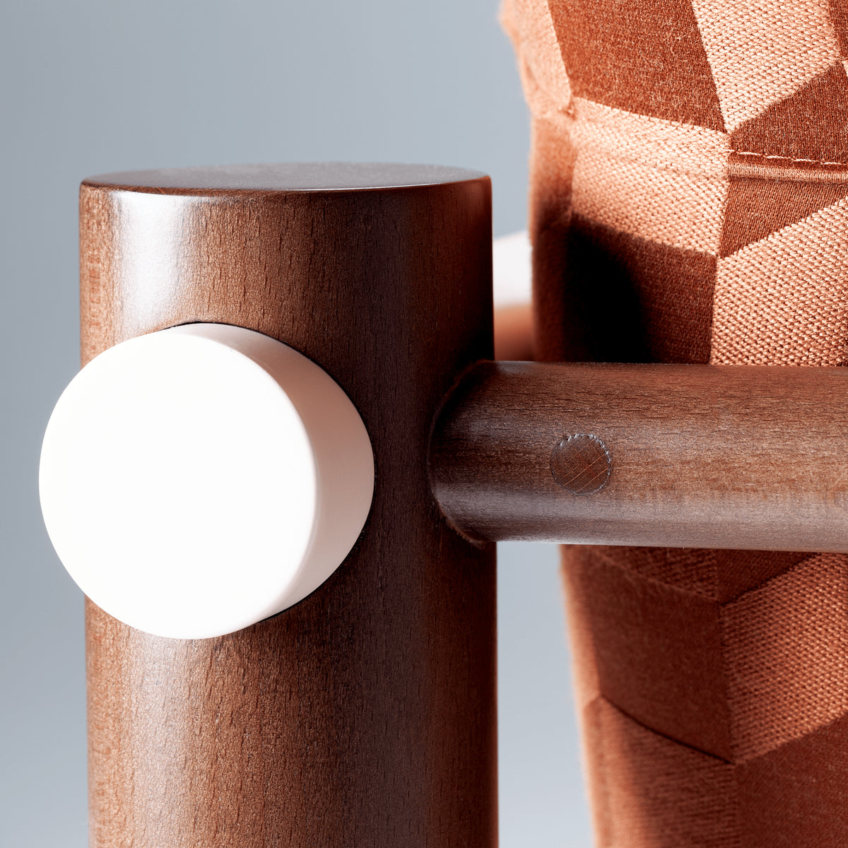 James Armchair close-up of the ivory armrest cap on the dark beech frame