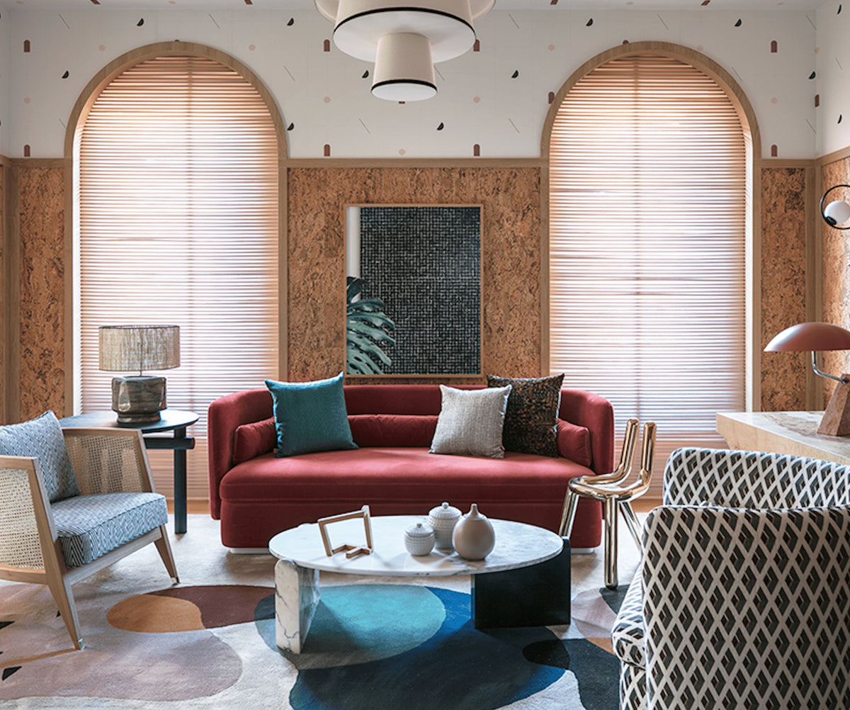 Jean Coffee Table in a terracotta living room with red pillows and patterned rug