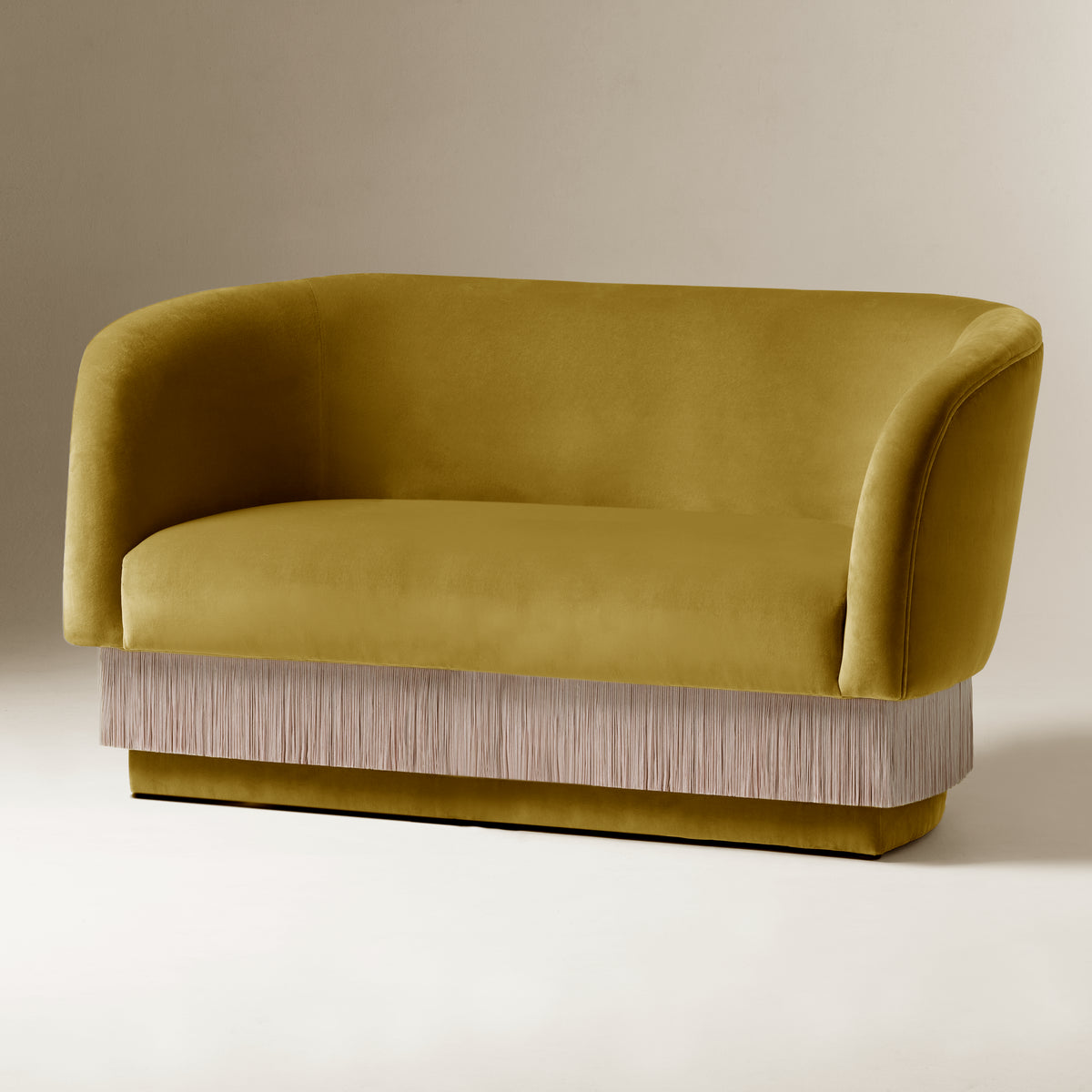 La Folie Sofa in Safran velvet with cream fringe trim, front three-quarter view