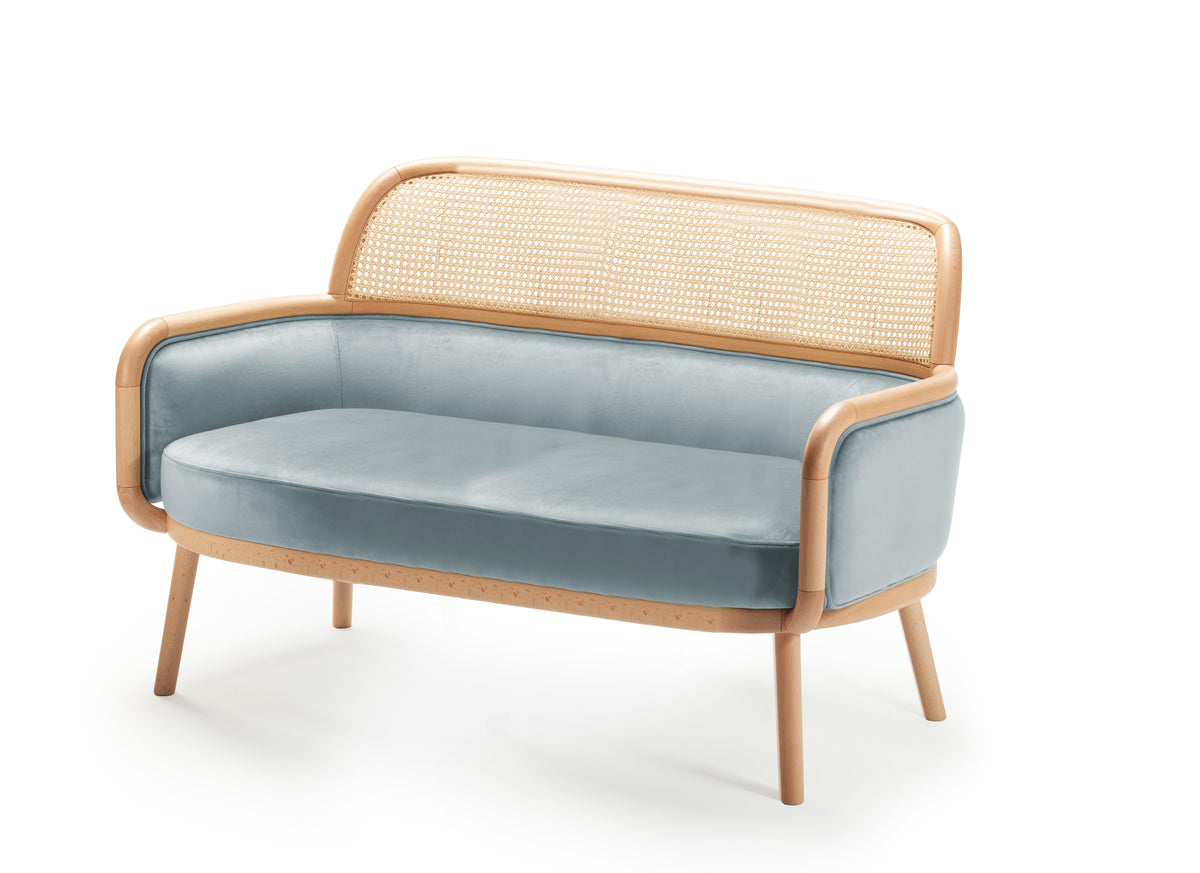 Luc Sofa Large in light blue velvet with cane backrest, three-quarter view
