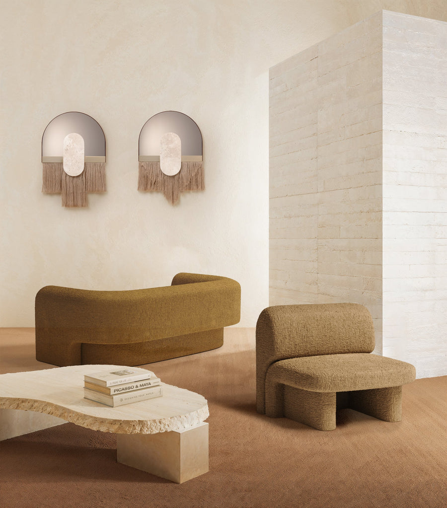 Slide armchair and sofa in a living room by Maison Burgos