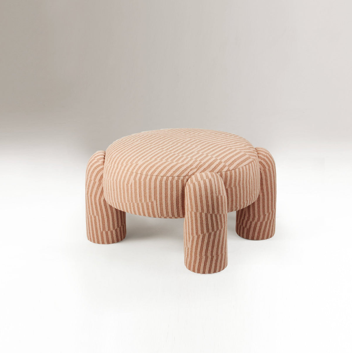Marlon Pouf in pink and rust striped weave