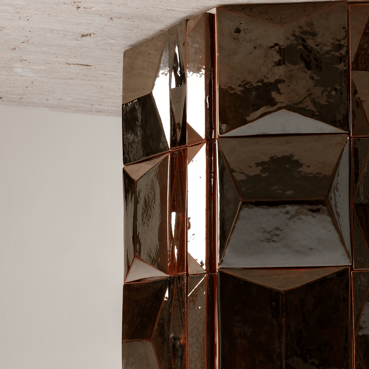 Milano Dining Table close-up of the faceted glazed ceramic tile base
