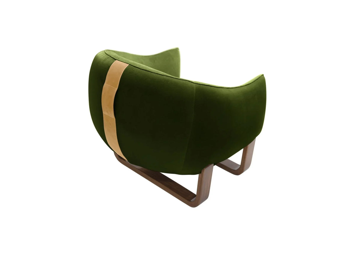 Milo Armchair back view in moss green velvet with tan leather strap
