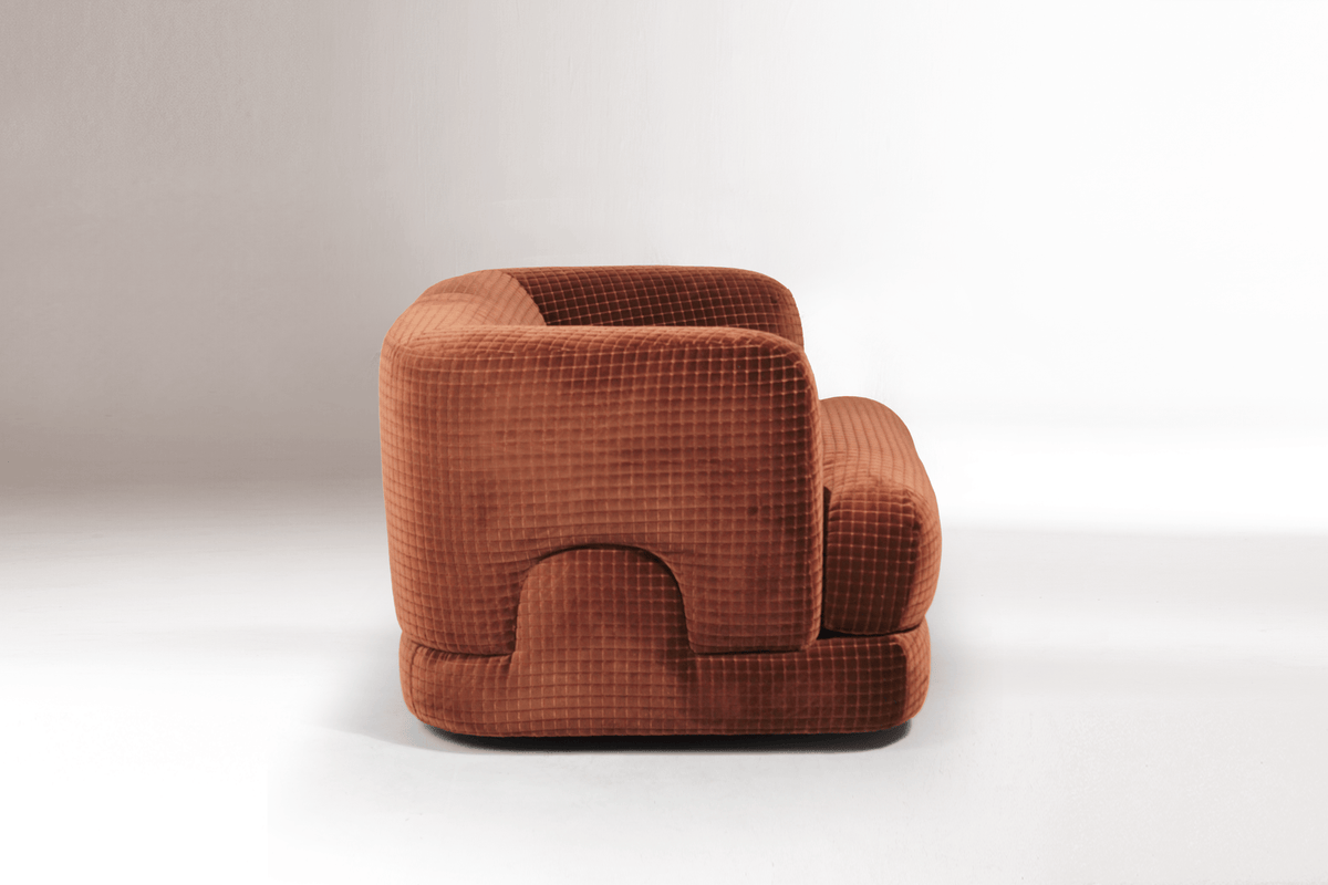 Mosaico Armchair in rust grid-textured velvet, three-quarter view on white