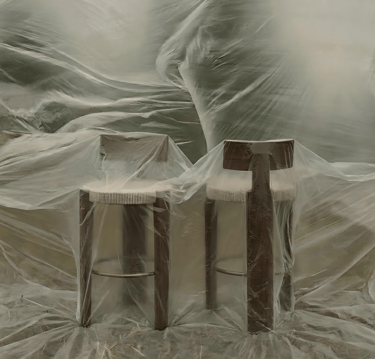 Nest Bar & Counter Stools draped in sheer plastic sheeting
