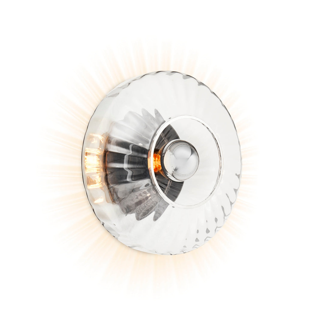 New Wave Optic Wall Sconce in Clear glass, three-quarter view, lit