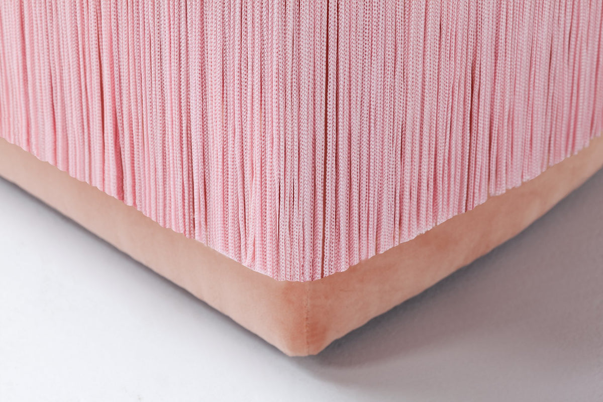 La Folie Armchair close-up of pink fringe and velvet base corner