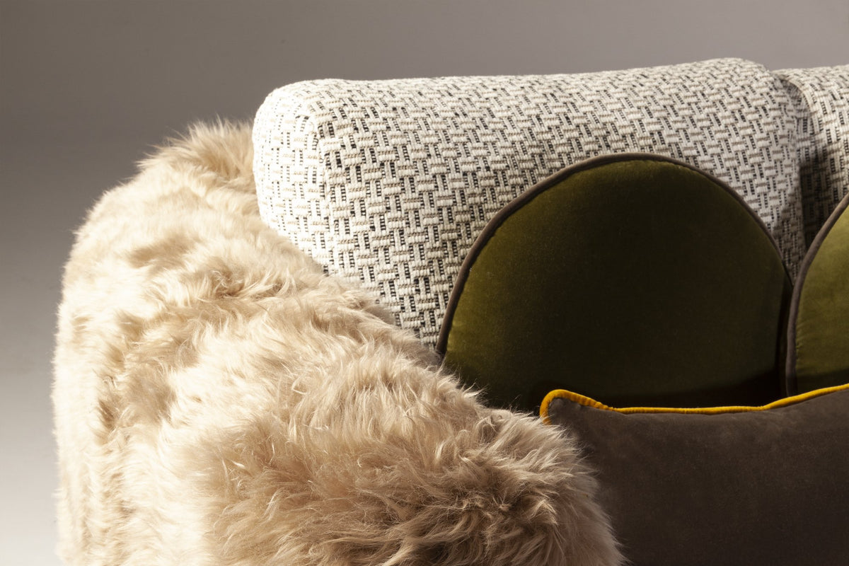 Single Man Deluxe Sofa close-up of the shearling arm and green cushion