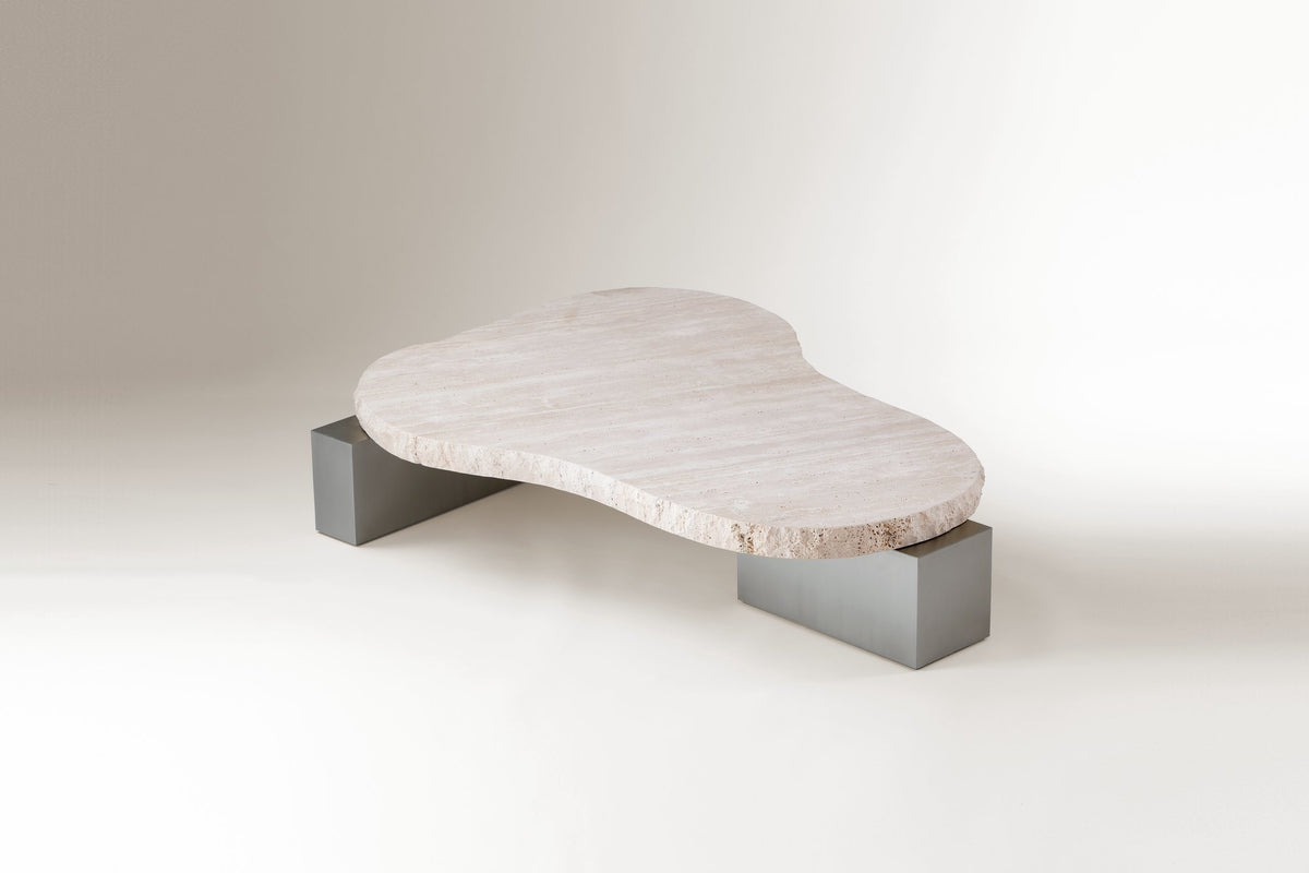 On The Rocks Coffee Table with travertine top and satin nickel base, angled view