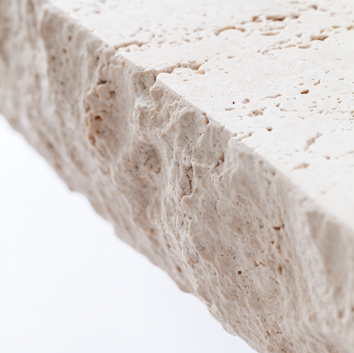 On The Rocks Console Table hand-hammered travertine top detail by Maison Burgos