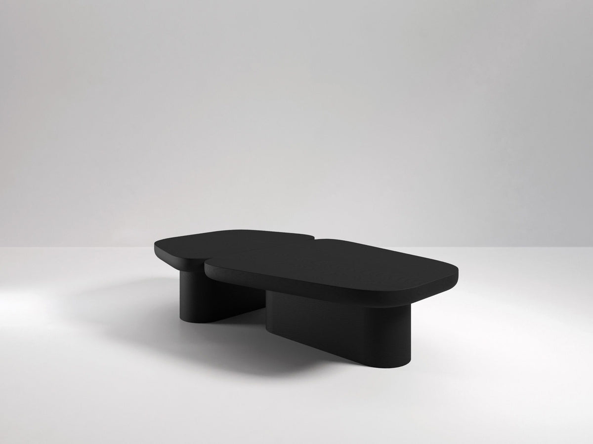 Pangea Coffee Table in black on a grey backdrop, three-quarter view