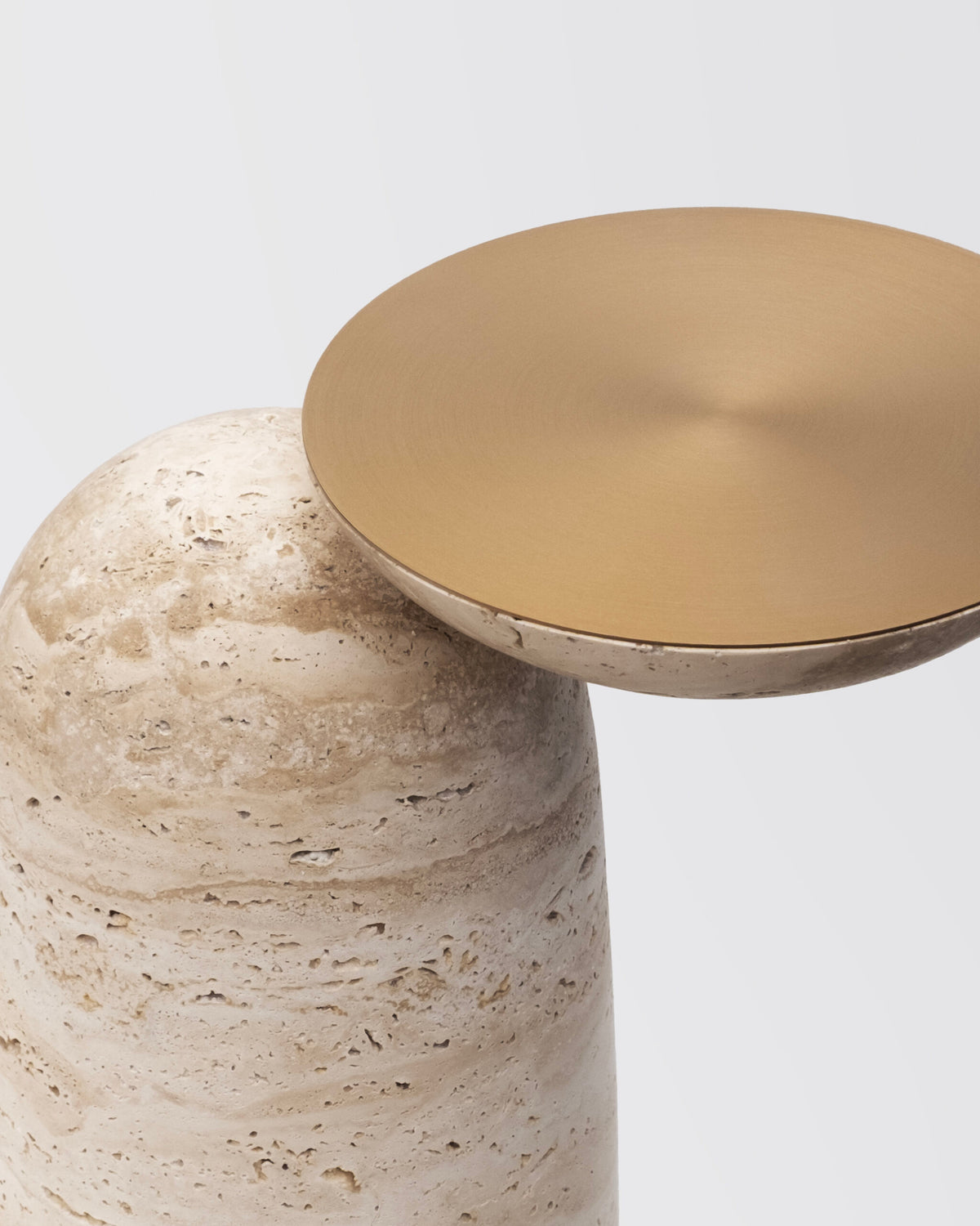 Pingu X Side Table, close-up of the Satin Brass top on Travertino Open Pore