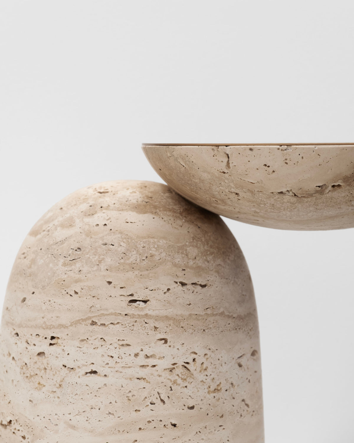 Pingu X Side Table, detail of the travertine dish top resting on the dome base