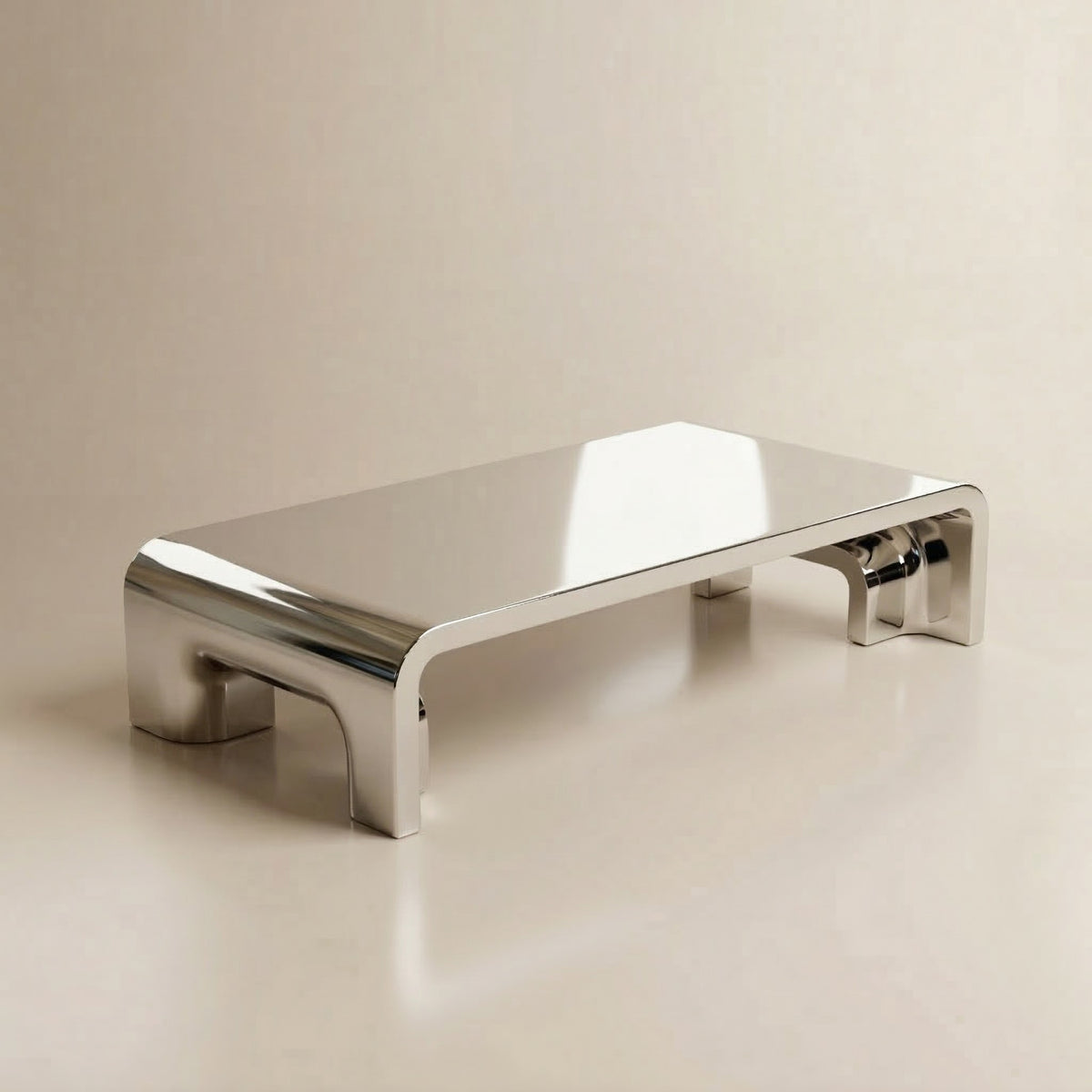 Plié Centre Table polished inox angled view by Maison Burgos