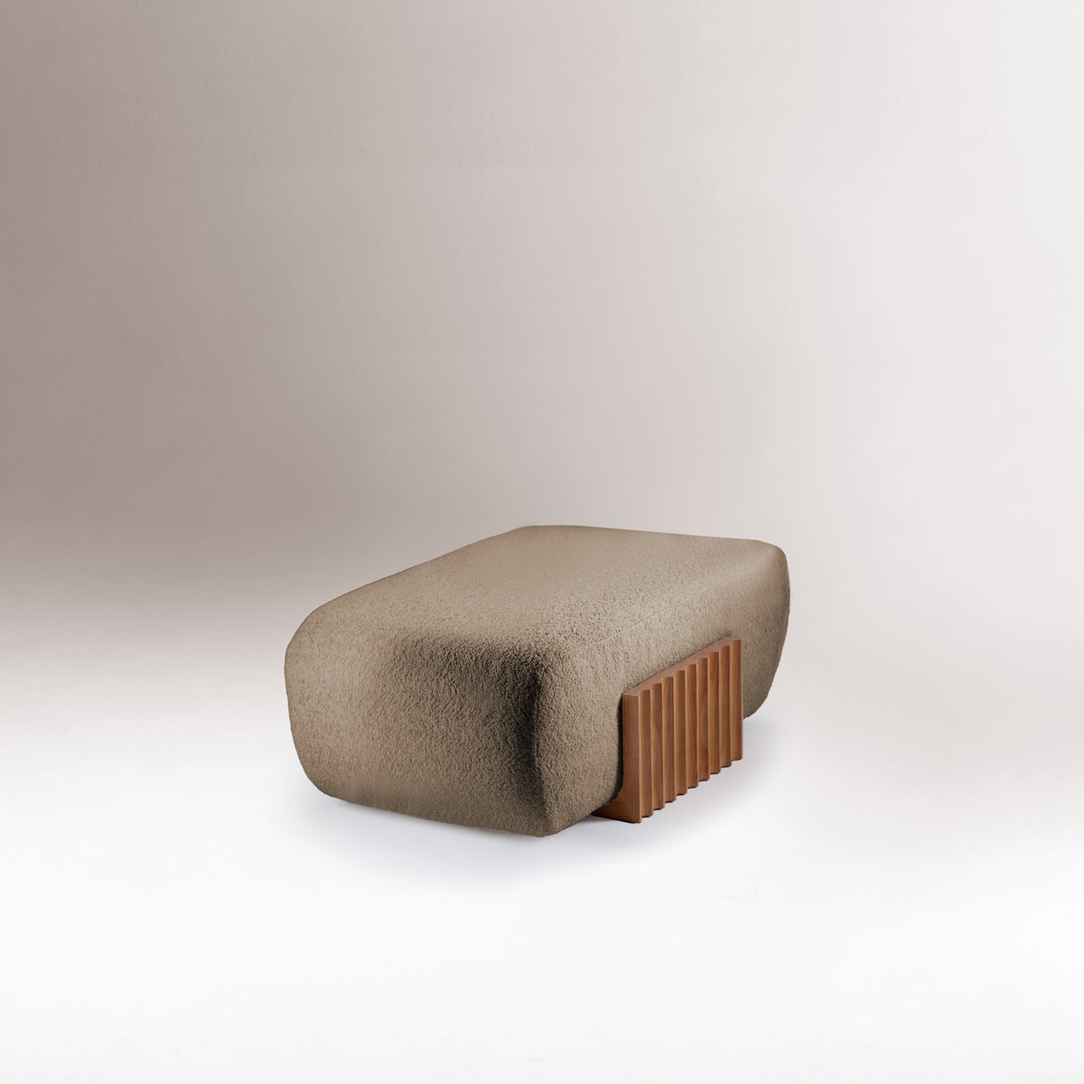 Carmel Ottoman in taupe boucle, low side view of the fluted base