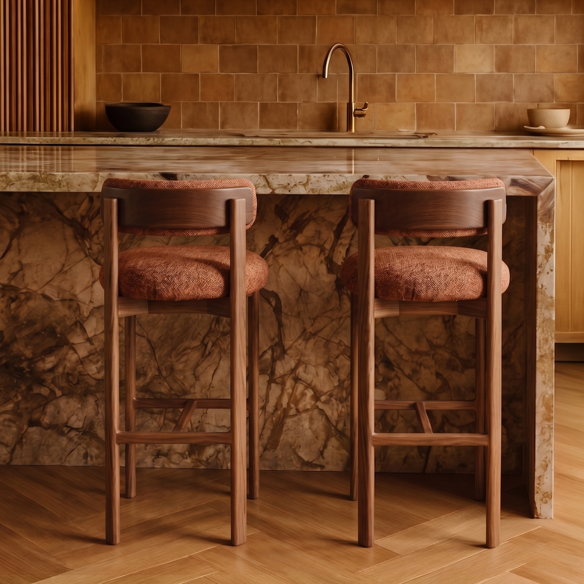 Pair of Siena bar stools in rust boucle at a marble kitchen island