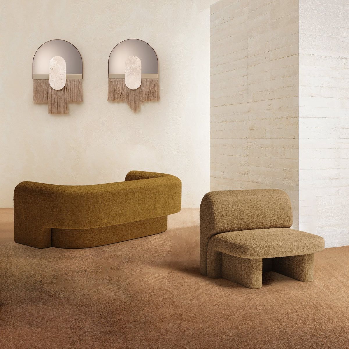 Slide Sofa in mustard upholstery with a matching lounge chair against a white brick wall