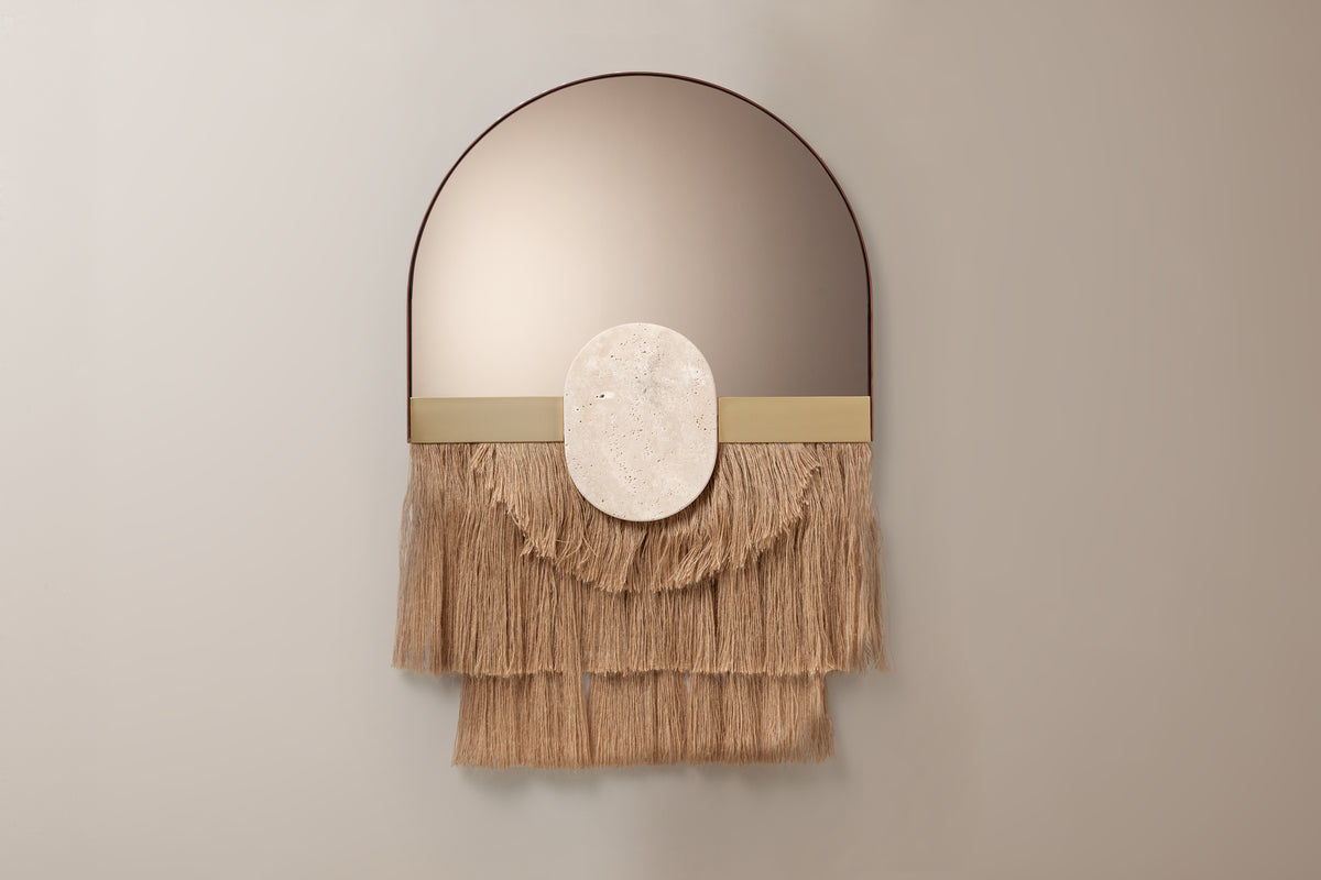 Souk Ecru Mirror Shell with layered scalloped fringe on a taupe wall