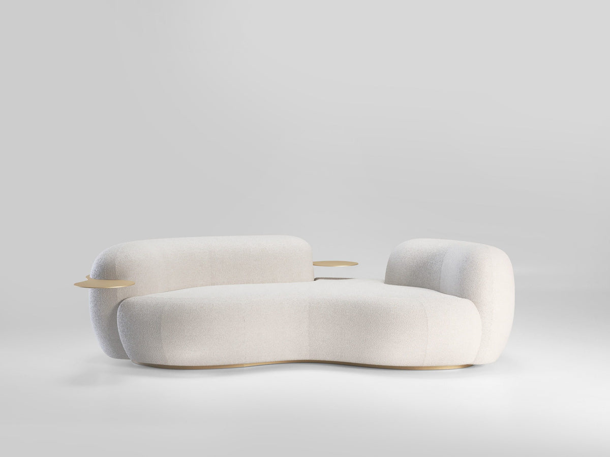 Tateyama Curved Sofa in white boucle on a grey backdrop, three-quarter view