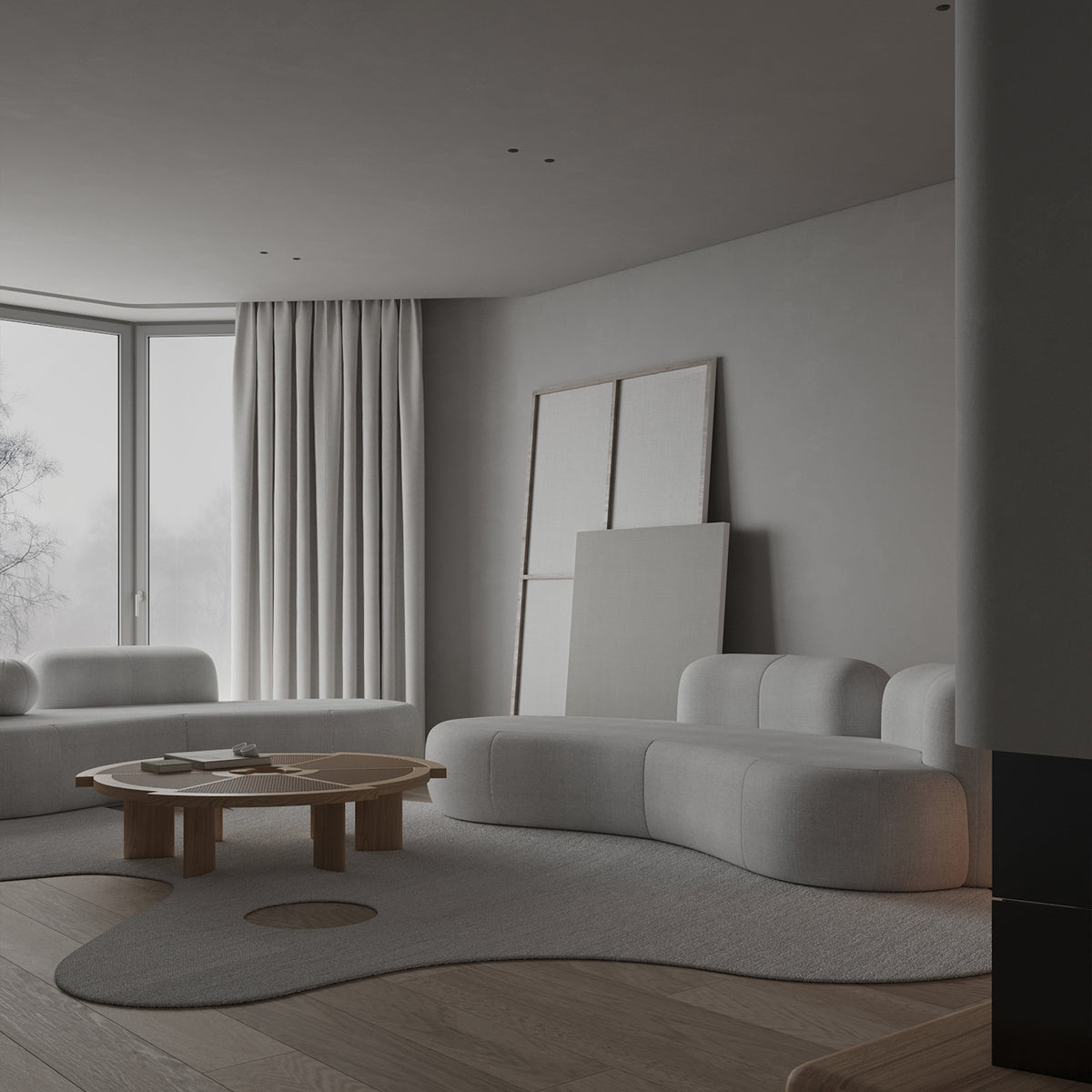 Tateyama XL Sofa in white boucle, angled view with a round wood table and grey rug