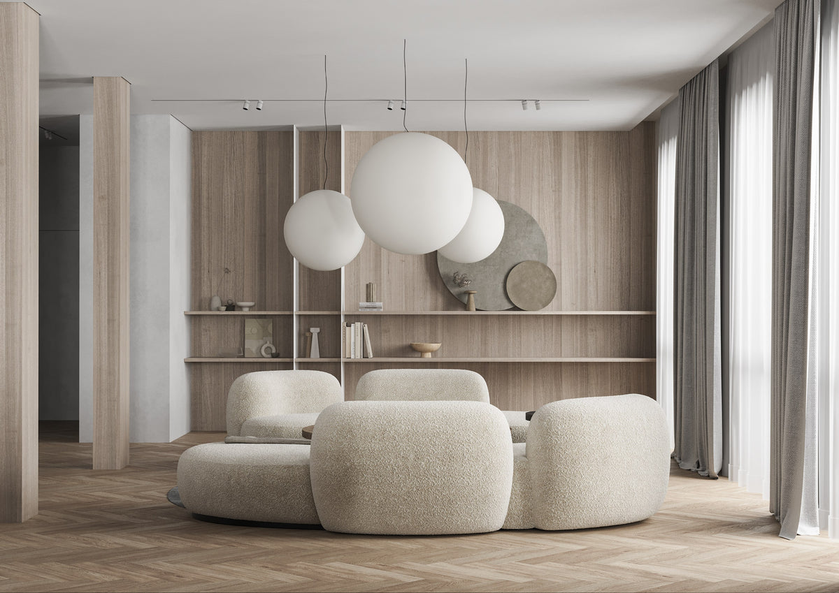 Tateyama XL Sofa in cream boucle under globe pendants in a wood-panelled living room