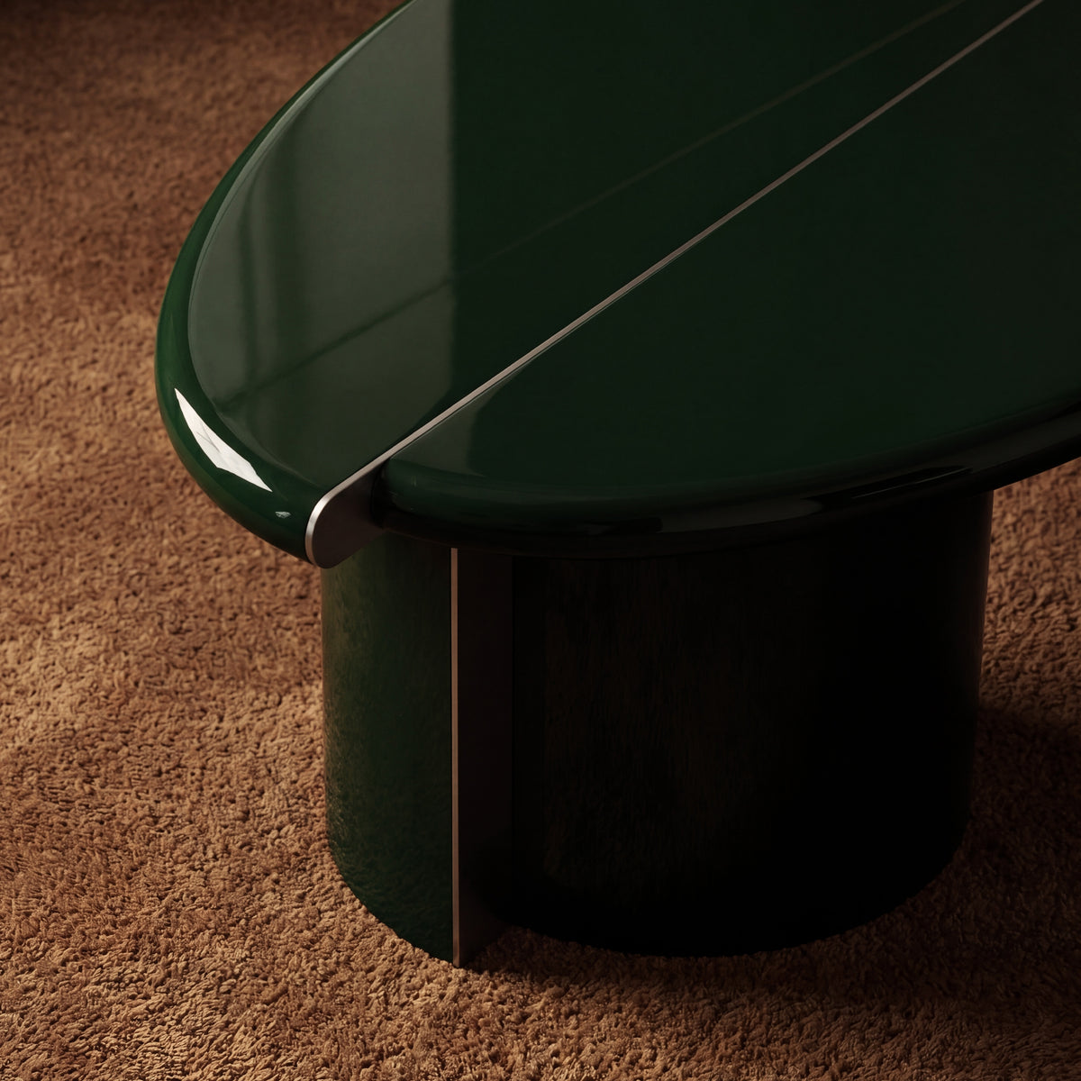 Tayma Coffee Table in Bottle Green, close detail of top and base on a brown rug