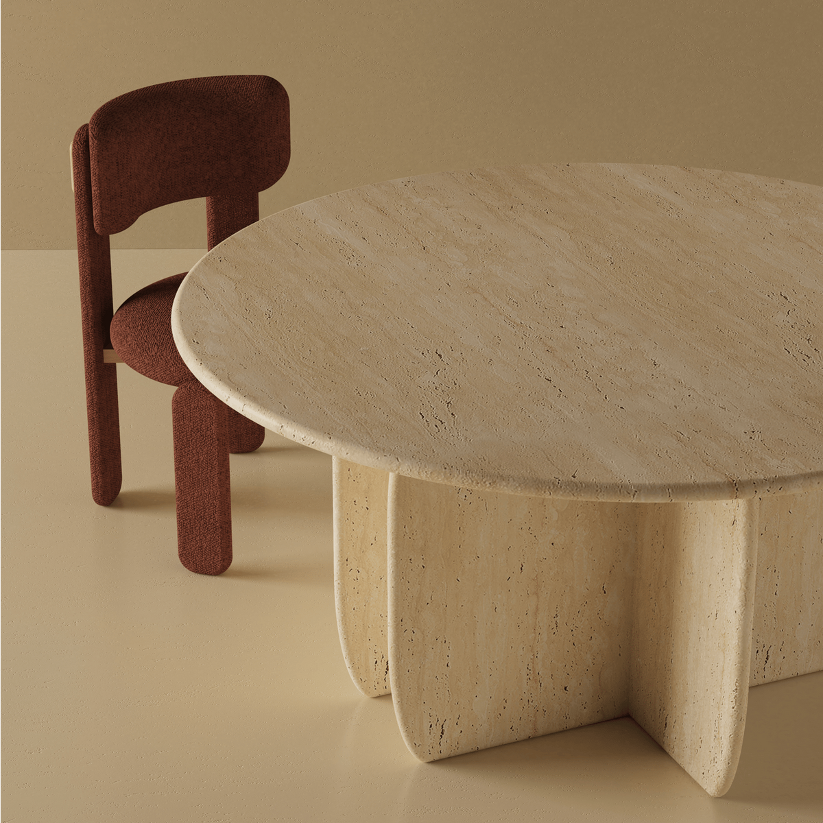 Choux Dining Chair in burgundy beside a round travertine dining table