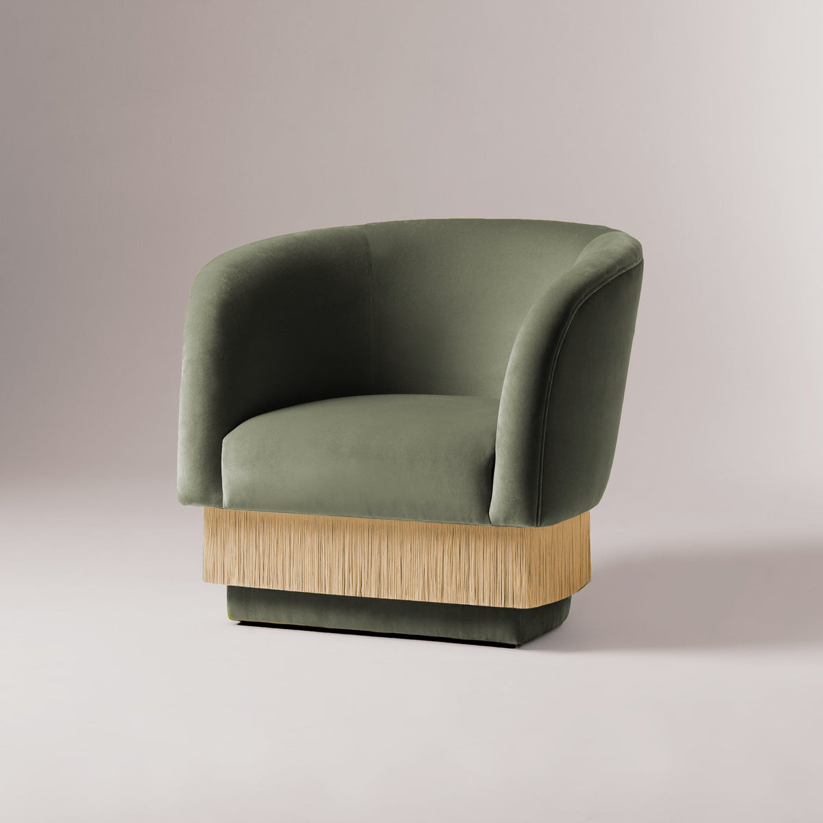 La Folie Armchair in sage green velvet with natural-tone fringe