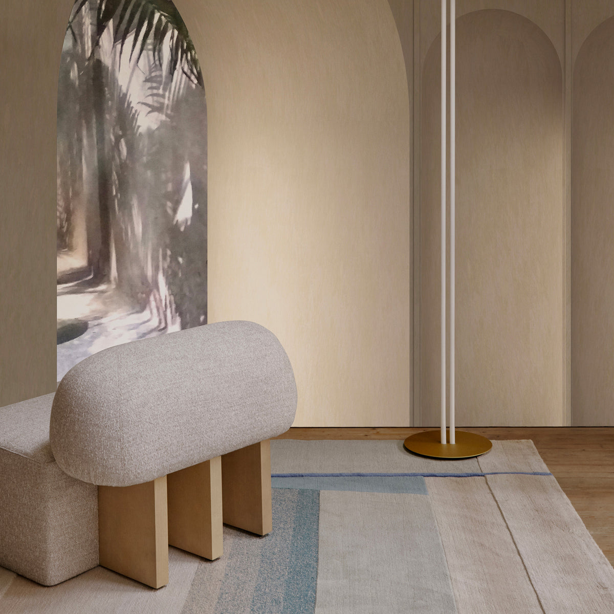 Yemeni Lounge Chair, close view of the cream boucle back and oak legs by a mural
