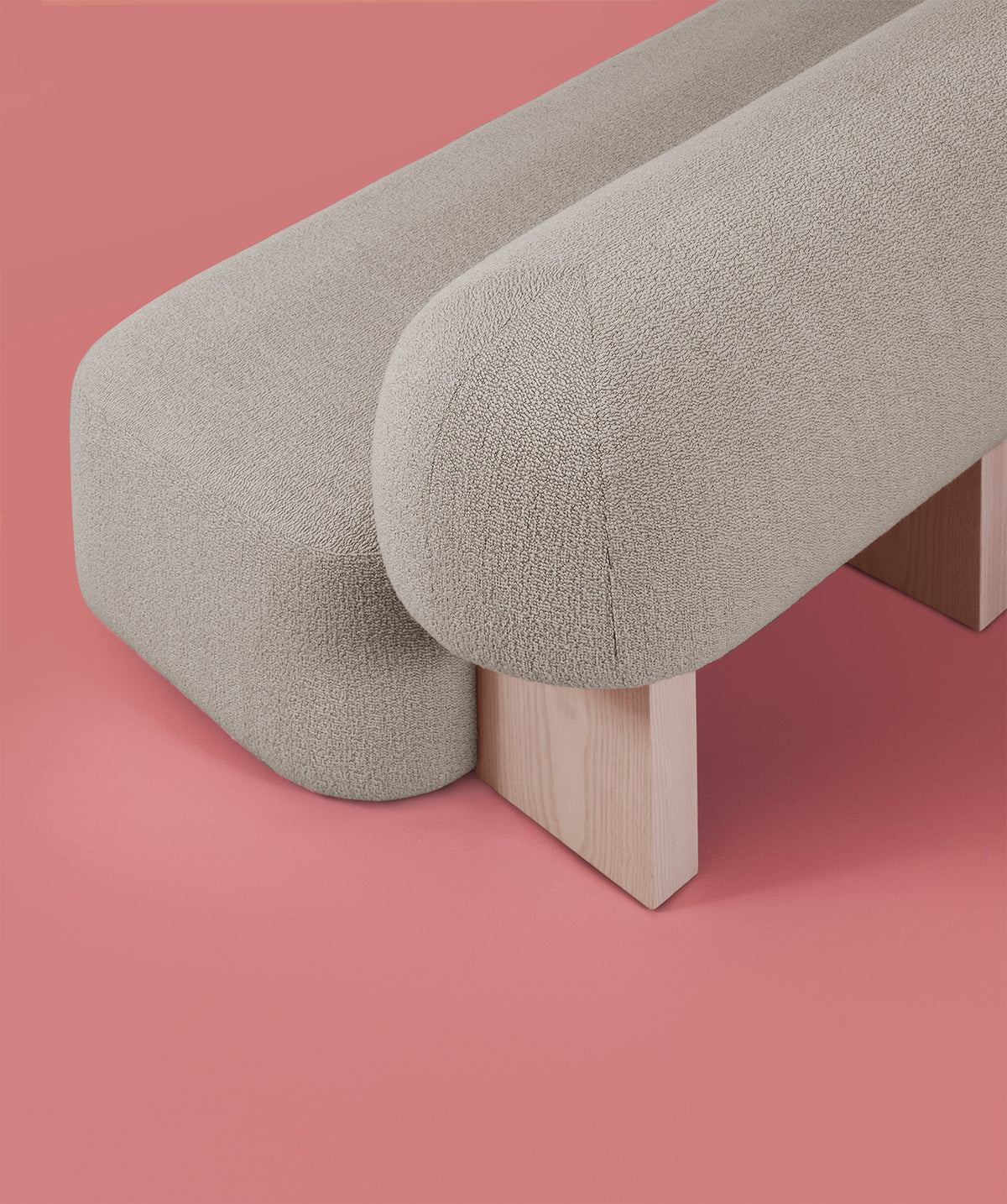 Yemeni Sofa close-up of the bolster back and seat ends on a pink floor